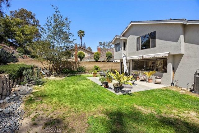 view of yard featuring a fenced backyard and a patio