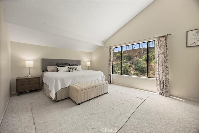 carpeted bedroom with baseboards and high vaulted ceiling