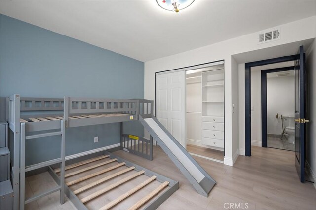 8535 Village Ln, Rosemead, CA 91770 - bedroom with visible vents, light wood-style flooring, baseboards, and a closet