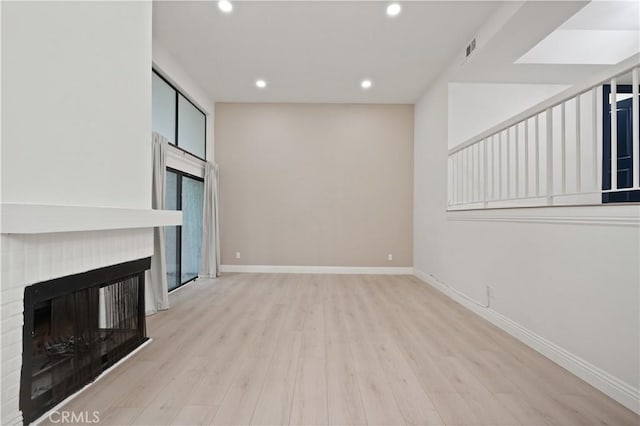 8535 Village Ln, Rosemead, CA 91770 - unfurnished living room featuring recessed lighting, baseboards, wood finished floors, and a fireplace