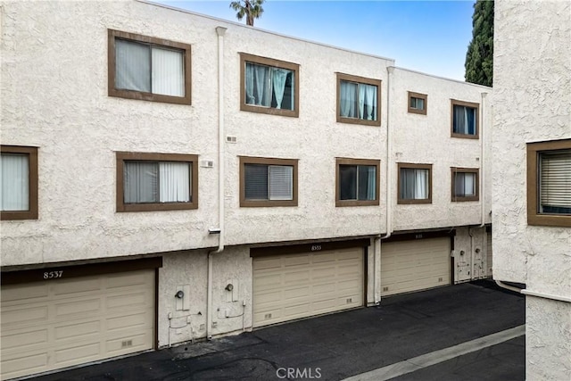 8535 Village Ln, Rosemead, CA 91770 - view of building exterior with an attached garage