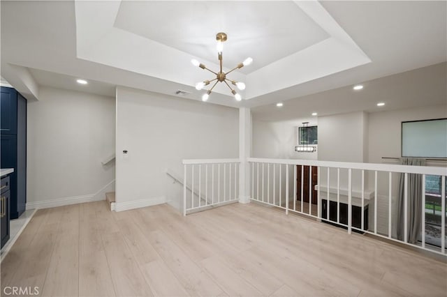 8535 Village Ln, Rosemead, CA 91770 - empty room with a raised ceiling, light wood-style floors, a chandelier, recessed lighting, and visible vents