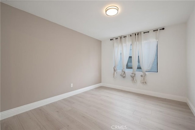 8535 Village Ln, Rosemead, CA 91770 - unfurnished room with baseboards and light wood-style flooring