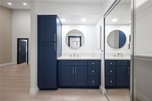 8535 Village Ln, Rosemead, CA 91770 - full bath featuring vanity, recessed lighting, baseboards, and wood finished floors