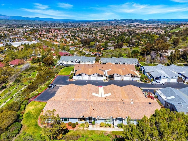 drone / aerial view featuring a residential view and a mountain view
