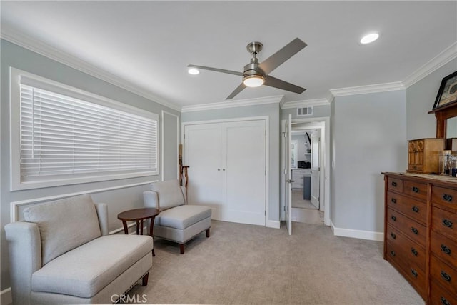 living area featuring baseboards, ornamental molding, ceiling fan, and visible vents