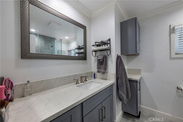 bathroom with crown molding, baseboards, walk in shower, and vanity