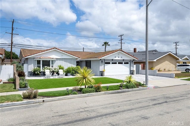 ranch-style home featuring fence, an attached garage, stucco siding, a front yard, and driveway