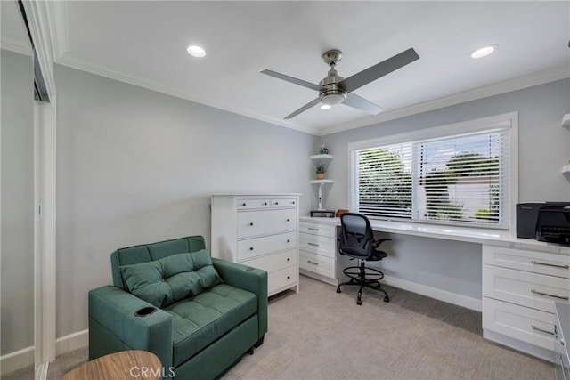 office with crown molding, baseboards, light carpet, and ceiling fan