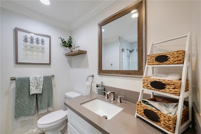 full bath featuring toilet, ornamental molding, a shower, and vanity