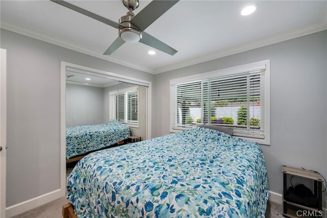 carpeted bedroom featuring ceiling fan, recessed lighting, baseboards, ornamental molding, and a closet
