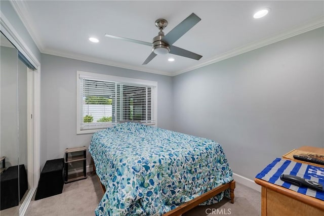 bedroom featuring a closet, recessed lighting, baseboards, and light carpet