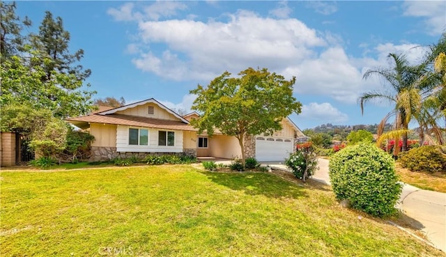 ranch-style home with an attached garage, a front lawn, stone siding, and concrete driveway