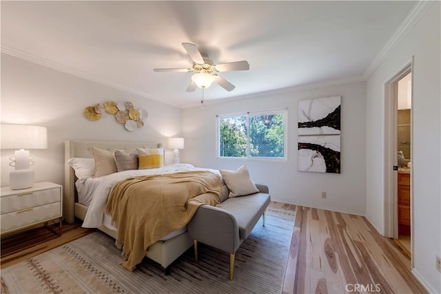 bedroom featuring crown molding, ceiling fan, and light wood finished floors