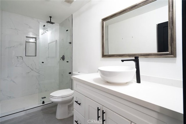 full bath featuring vanity, a marble finish shower, visible vents, and toilet