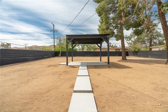 view of community with a patio and a fenced backyard