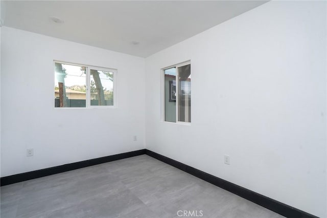 empty room featuring baseboards