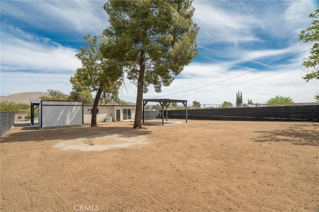 view of community featuring fence