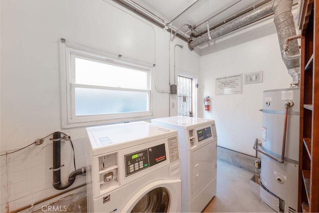 washroom featuring separate washer and dryer and water heater
