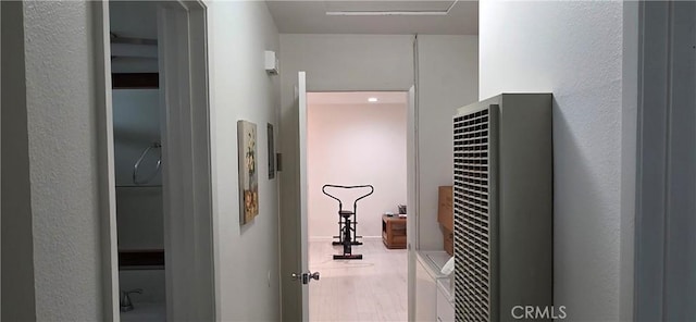 715 S Webster Ave Unit 30, Anaheim, CA 92804 - hallway featuring a heating unit, wood finished floors, and a textured wall