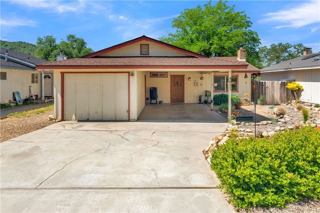 4957 Buck Tail Ln, Paso Robles, CA 93446 - view of front of property with driveway, a garage, and a chimney