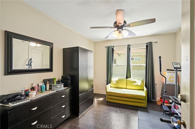 bedroom featuring dark wood-style flooring, baseboards, and ceiling fan