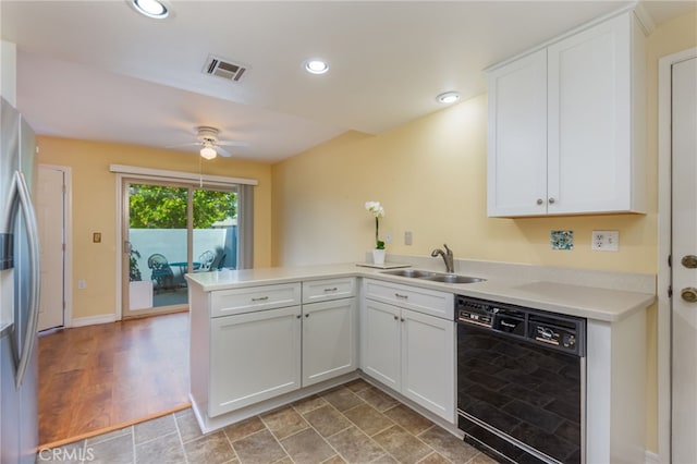 kitchen with a sink, dishwasher, a peninsula, stainless steel refrigerator with ice dispenser, and visible vents