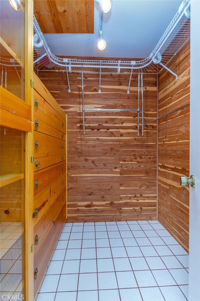 walk in closet featuring light tile patterned flooring