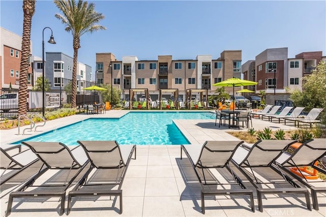 960 N Tangent Privado Unit 204, Ontario, CA 91764 - pool with a patio area, fence, and a residential view