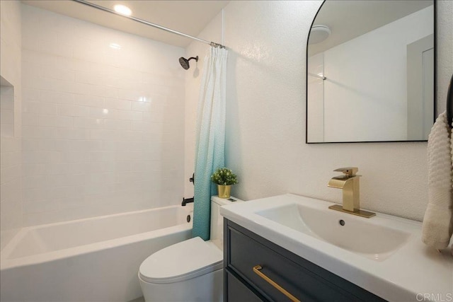 full bath with toilet, a textured wall, shower / bathtub combination with curtain, and vanity