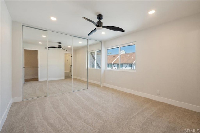 unfurnished bedroom with carpet flooring, recessed lighting, and baseboards