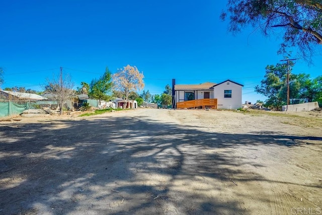 view of front of property featuring a wooden deck
