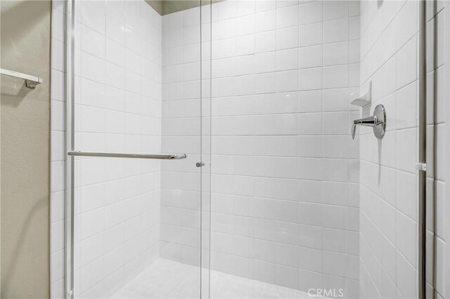 full bathroom with a shower stall