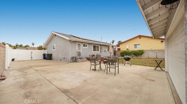 view of patio / terrace with outdoor dining area and a fenced backyard