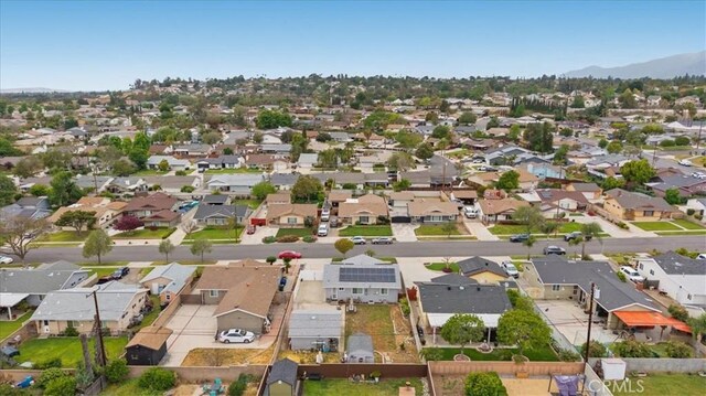 drone / aerial view with a residential view and a mountain view