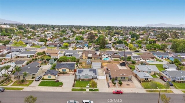 drone / aerial view featuring a mountain view and a residential view