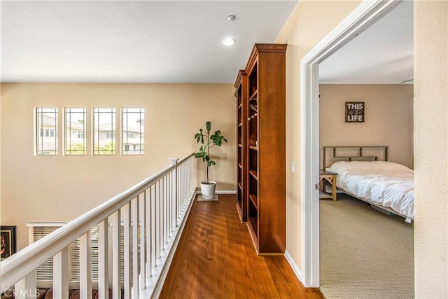 hallway with recessed lighting and wood finished floors
