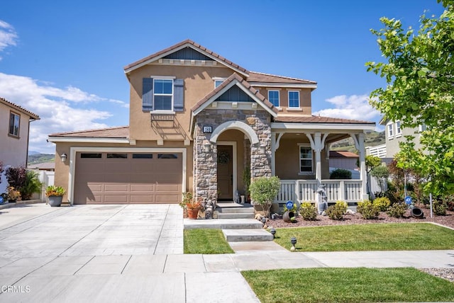 craftsman-style home with covered porch, concrete driveway, stone siding, and stucco siding