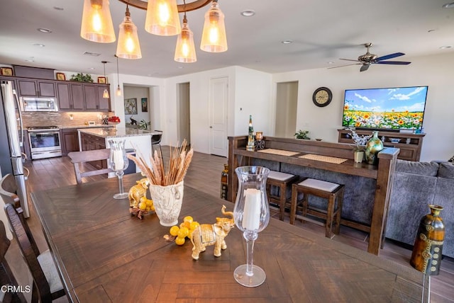 dining space with recessed lighting, ceiling fan, and visible vents