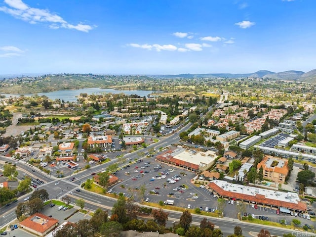 birds eye view of property featuring a water and mountain view