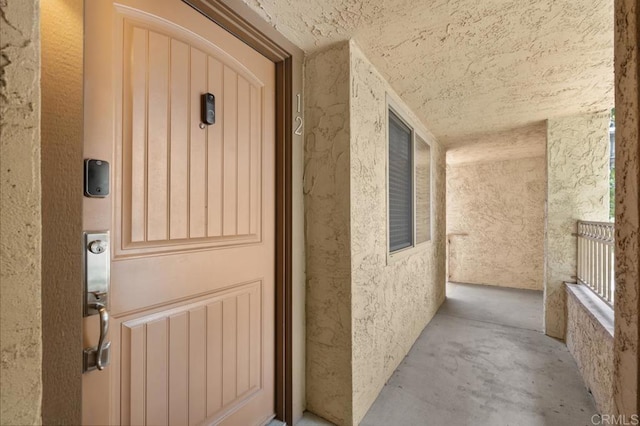 view of exterior entry featuring stucco siding