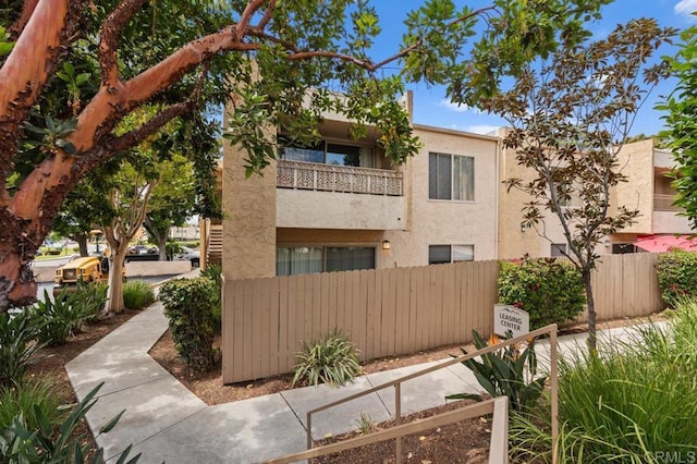 view of property with fence