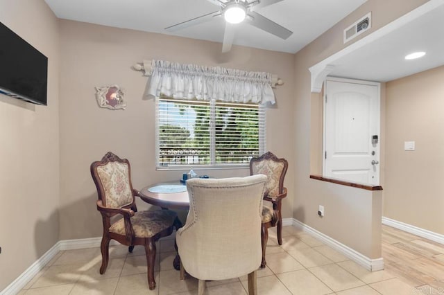 dining room with a ceiling fan, baseboards, and visible vents