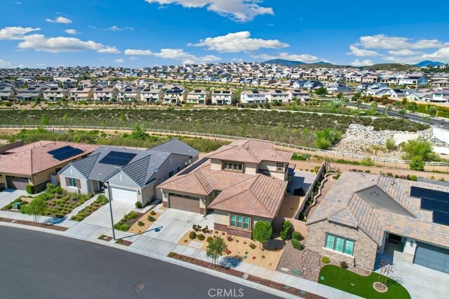 birds eye view of property with a residential view and a mountain view