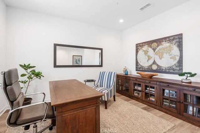 office area with recessed lighting, visible vents, and light wood finished floors