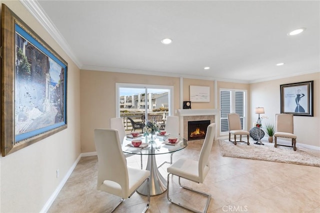 24612 Harbor View Dr Unit 55C, Dana Point, CA 92629 - dining room with baseboards, tile patterned floors, crown molding, recessed lighting, and a warm lit fireplace