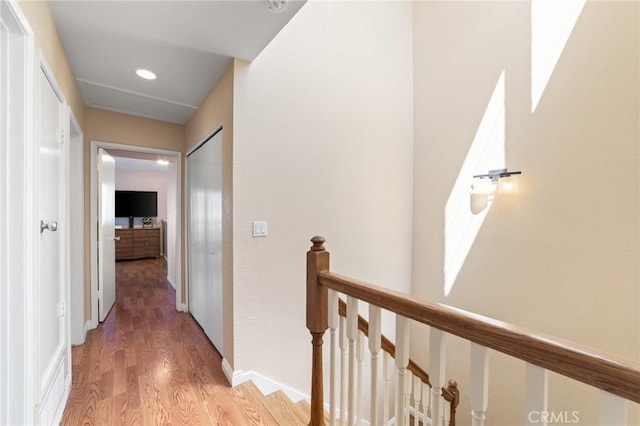 24612 Harbor View Dr Unit 55C, Dana Point, CA 92629 - hall with an upstairs landing, light wood finished floors, and recessed lighting