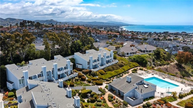 aerial view featuring a residential view and a water and mountain view