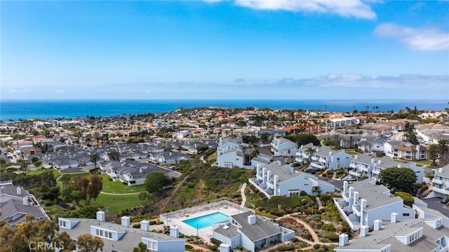 bird's eye view featuring a water view and a residential view