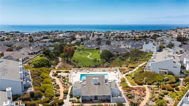 drone / aerial view featuring a water view and a residential view